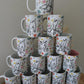 Personalised hand holding mug